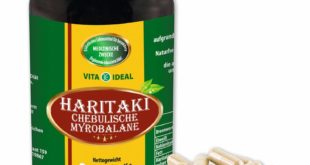 Haritaki Kapseln und Dose auf weissem Grund